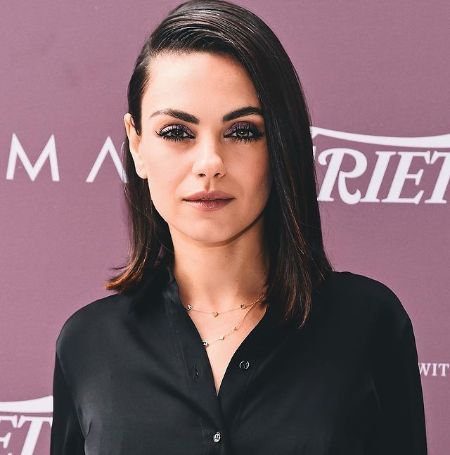 Mila Kunis posing for the camera.